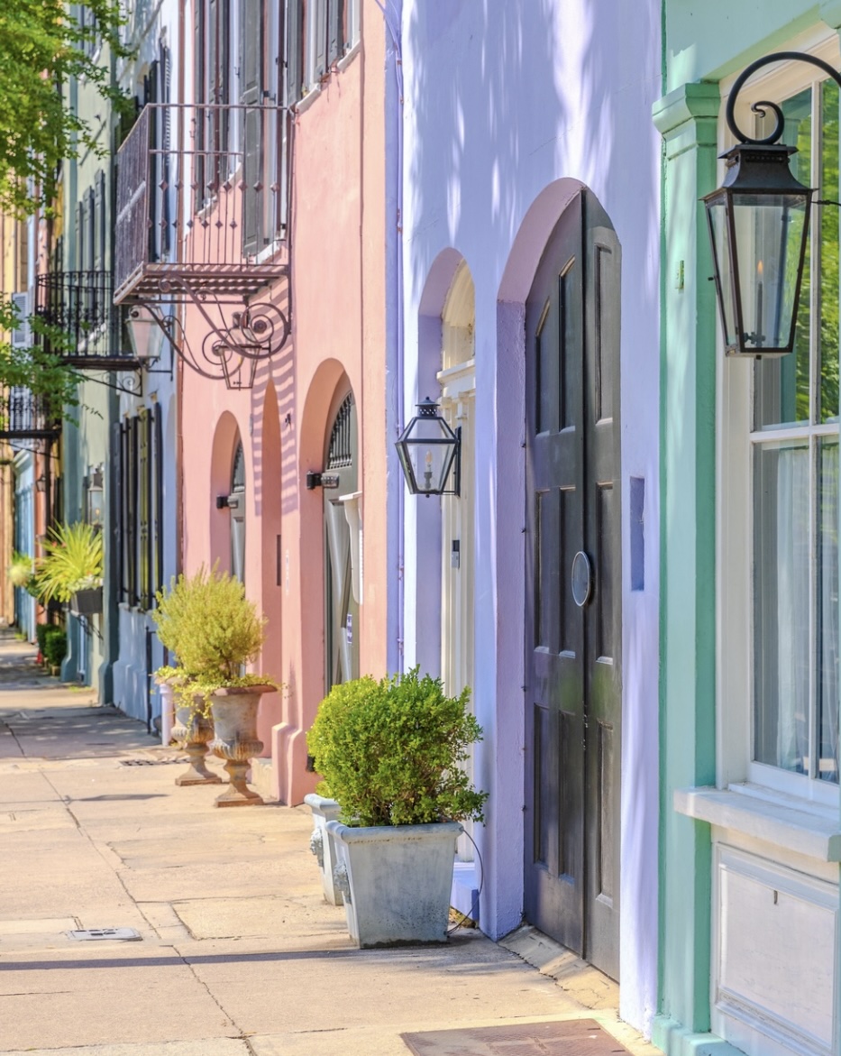 colorful pastel colored doorways lining a street