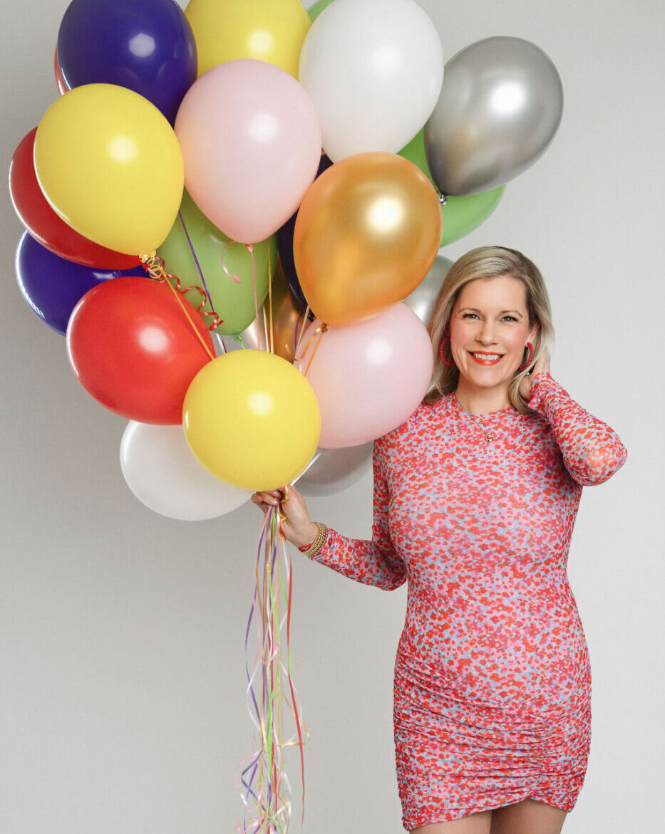 Courtney Doyle holding balloons